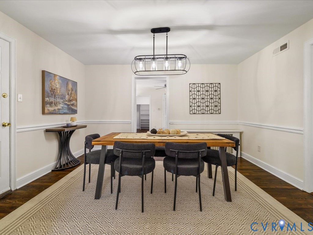 4803 Morrison Road Richmond, VA 23230 - Photo 12 of 45 a view of a dining room with furniture wooden floor and chandelier