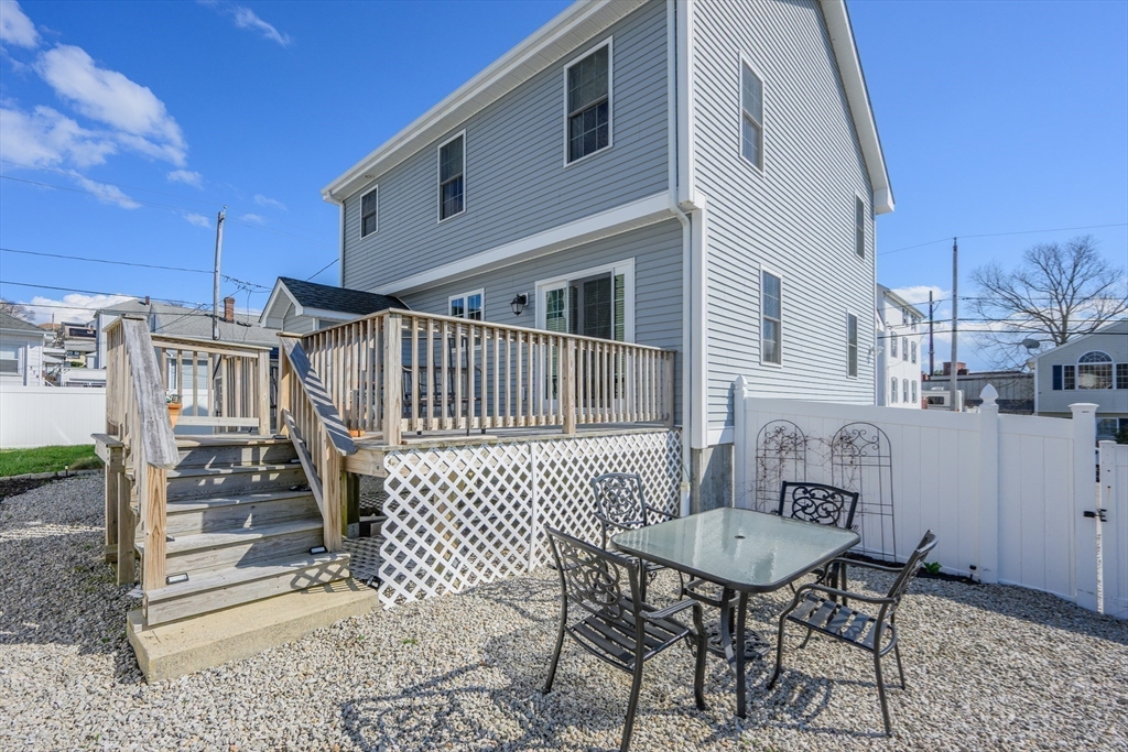 138 Sprague Street Fall River, MA 02724 - Photo 25 of 34 a view of a chairs with barbeque grill and wooden floor
