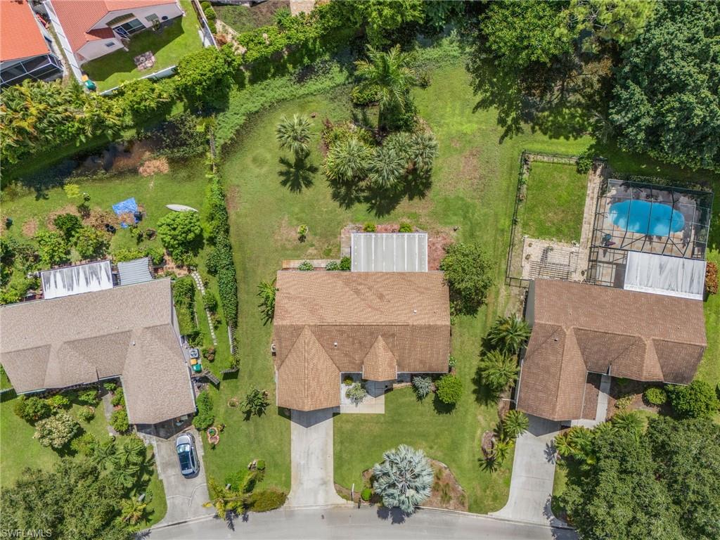 128 Plantation Circle Naples, FL 34104 - Photo 24 of 27 an aerial view of a house with a yard basket ball court and outdoor seating