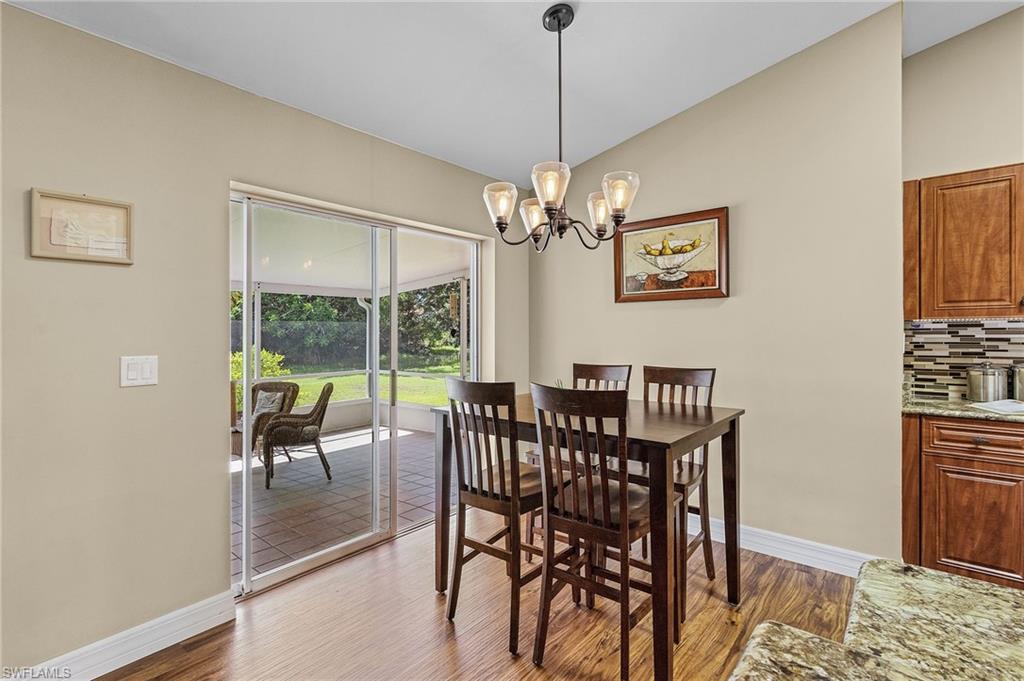 128 Plantation Circle Naples, FL 34104 - Photo 9 of 27 a view of a dining room with furniture window and outside view