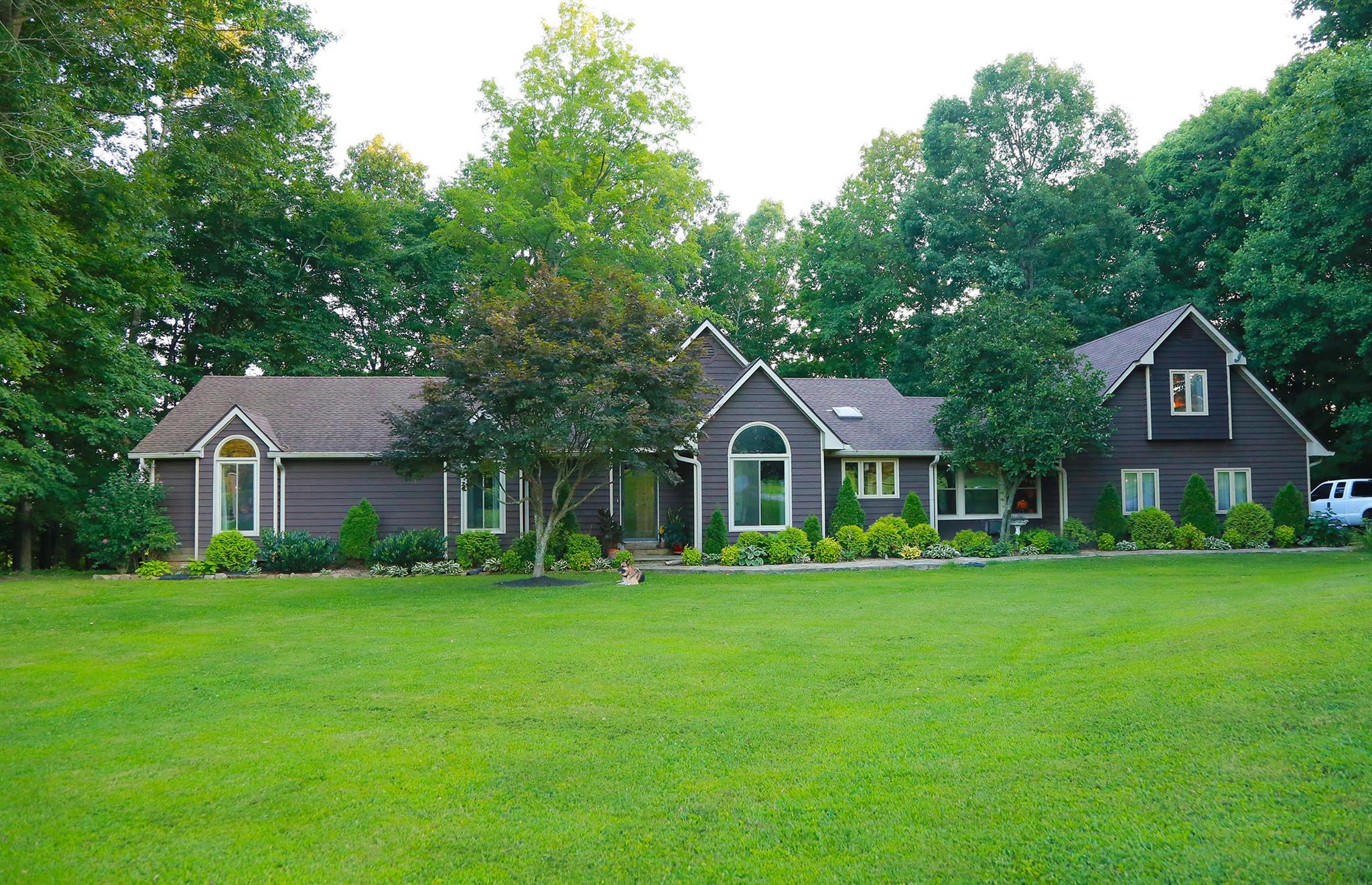 2004 Lawrence Lane Springfield, TN 37172 - Photo 1 of 30 a front view of a house with a garden