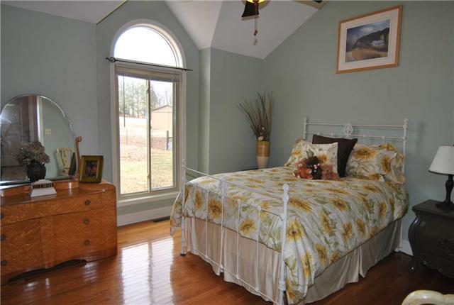 2004 Lawrence Lane Springfield, TN 37172 - Photo 11 of 30 a bedroom with a bed a dresser next to a window