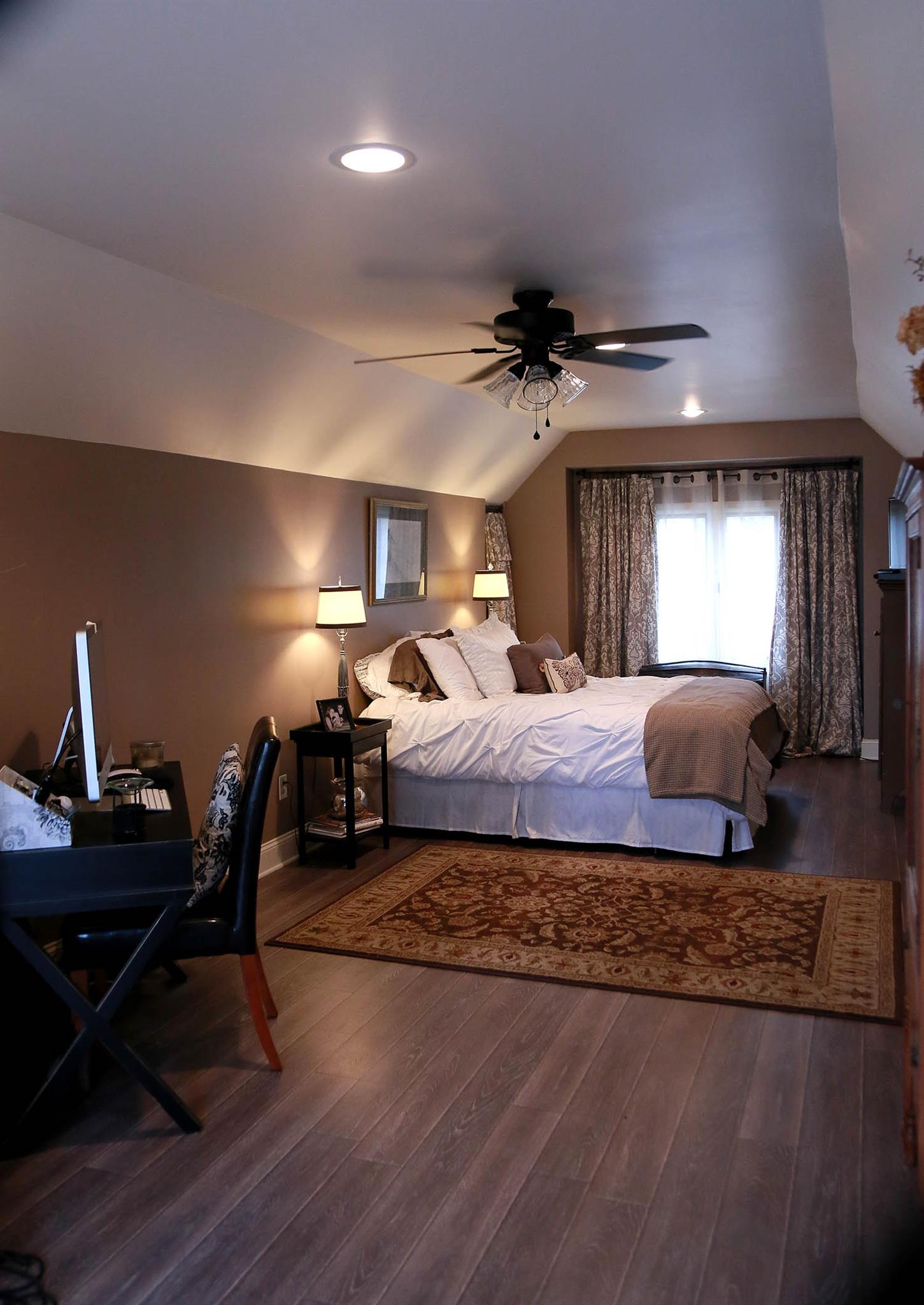 2004 Lawrence Lane Springfield, TN 37172 - Photo 18 of 30 a spacious bedroom with a bed a desk and chair