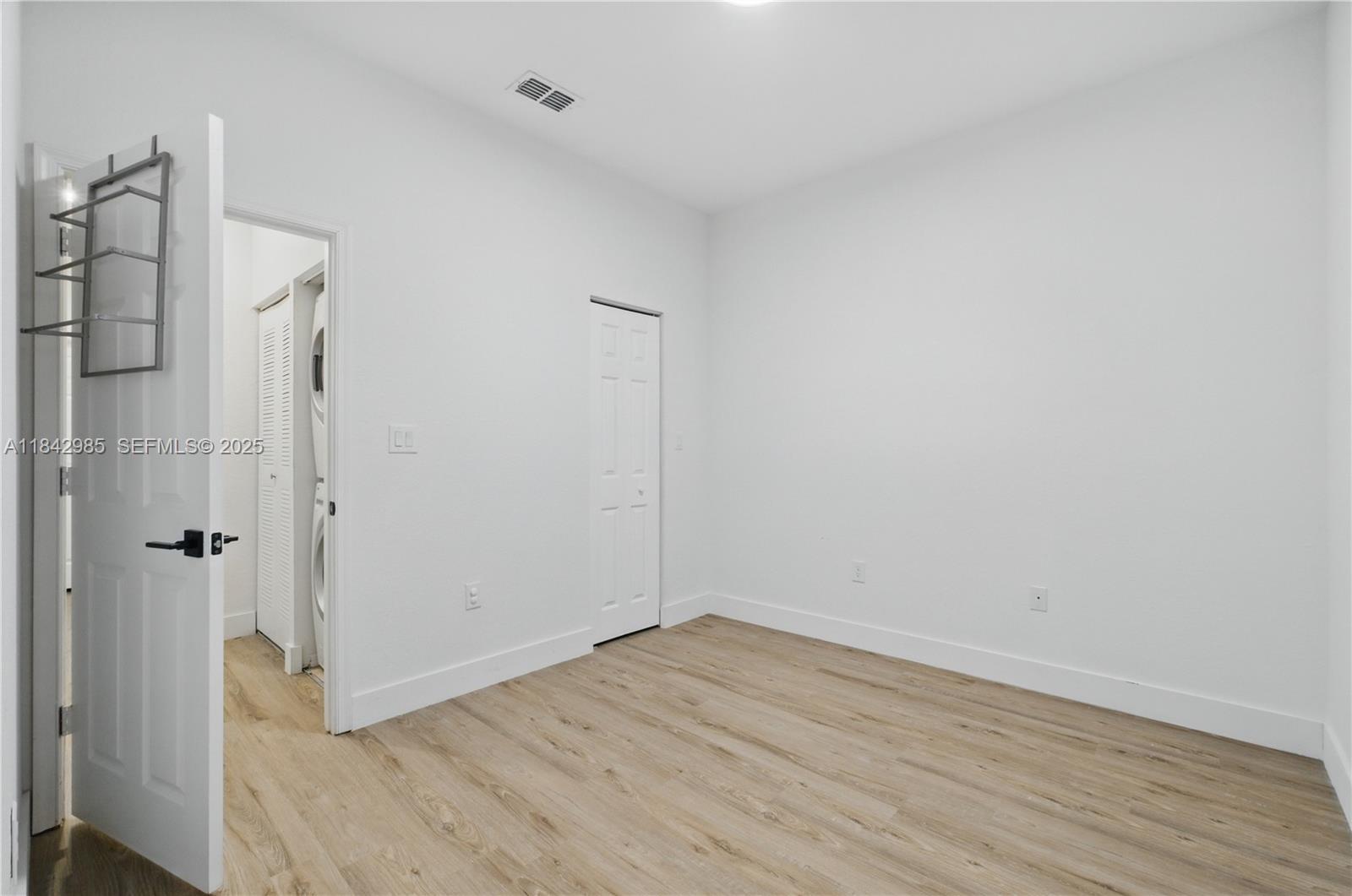 2851 Prospect Road, Unit 307 Tamarac, FL 33309 - Photo 16 of 21 wooden floor in an empty room