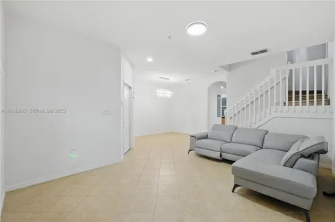 a living room with furniture and a couch