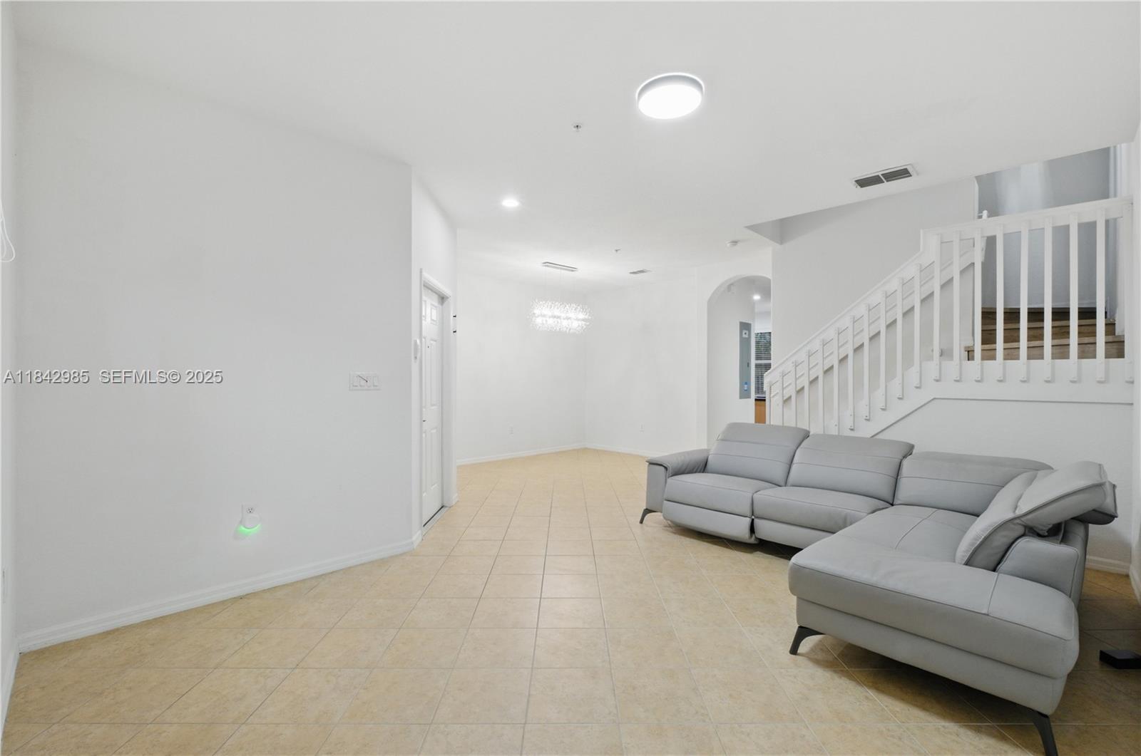 2851 Prospect Road, Unit 307 Tamarac, FL 33309 - Photo 3 of 21 a living room with furniture and a couch