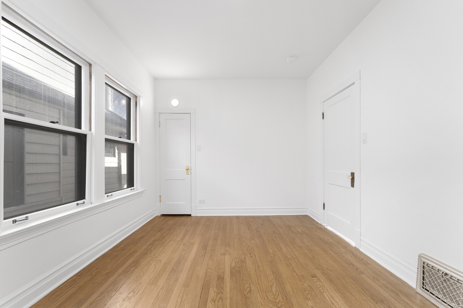 1035 South Ridgeland Avenue Oak Park, IL 60304 - Photo 16 of 33 a view of empty room with wooden floor and fan