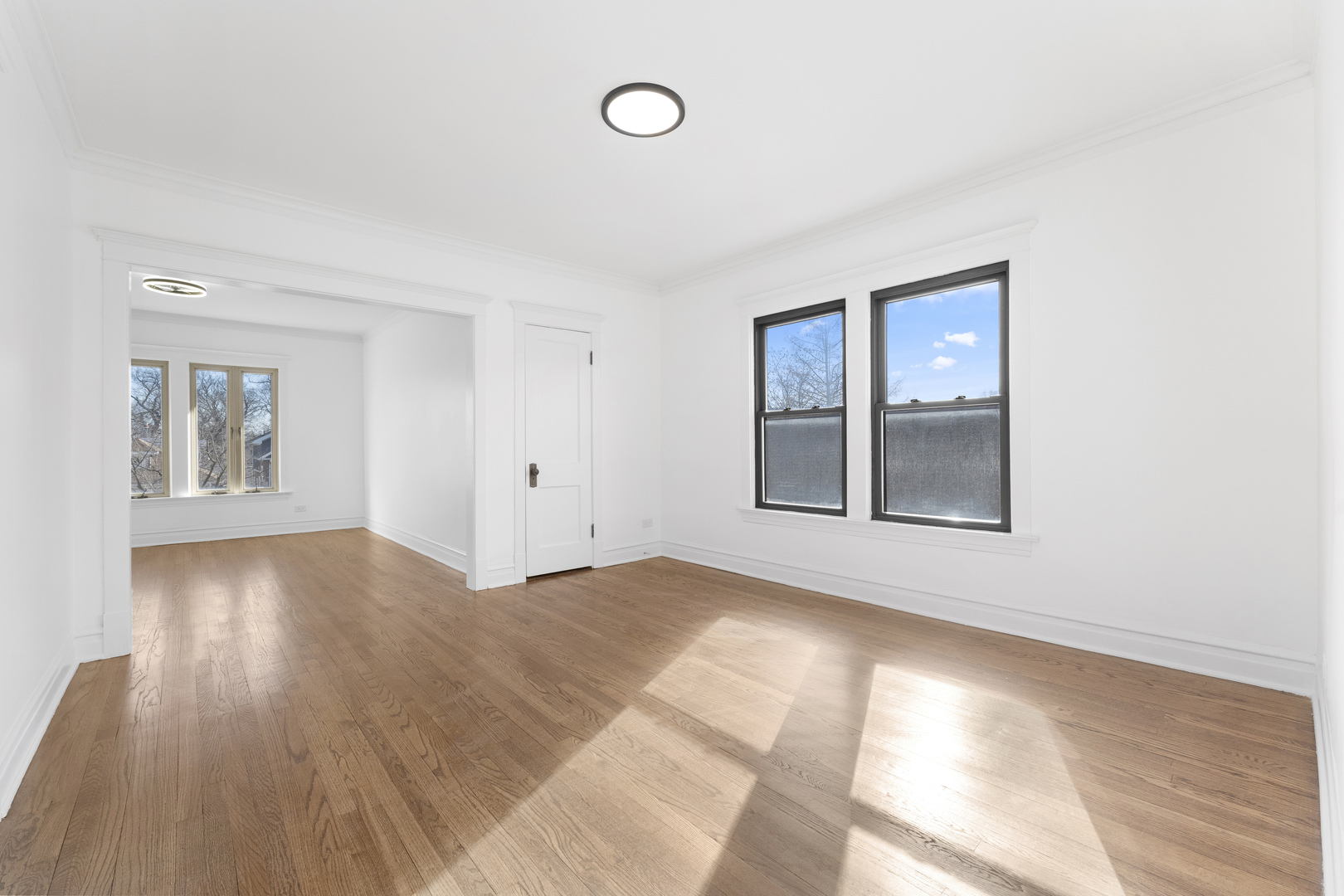 1035 South Ridgeland Avenue Oak Park, IL 60304 - Photo 20 of 33 a view of an empty room with wooden floor and a window