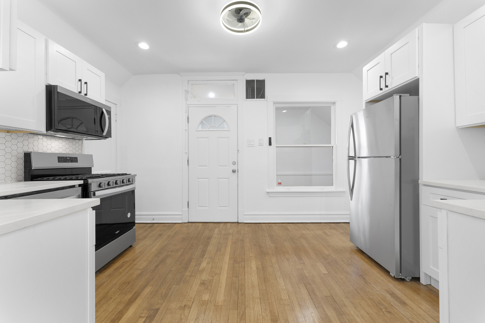 1035 South Ridgeland Avenue Oak Park, IL 60304 - Photo 21 of 33 a kitchen with a refrigerator and a stove top oven
