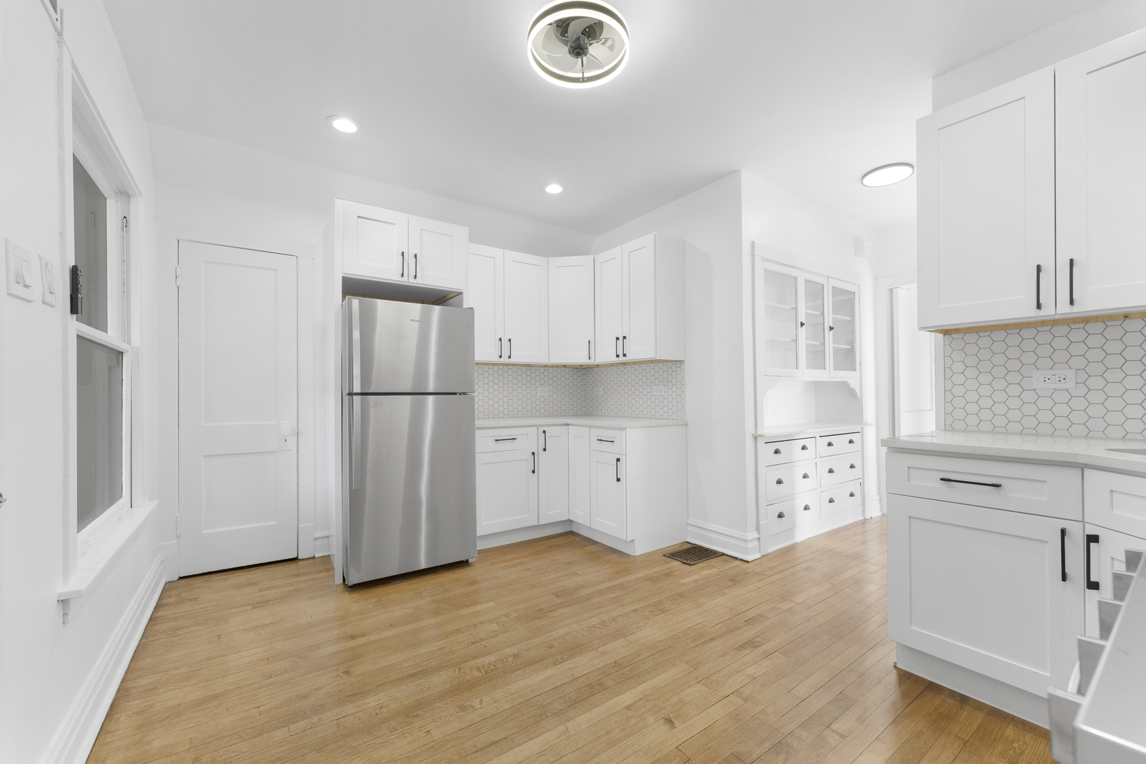 1035 South Ridgeland Avenue Oak Park, IL 60304 - Photo 22 of 33 a kitchen with stainless steel appliances granite countertop a refrigerator and a stove top oven