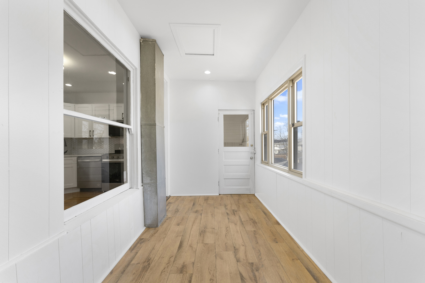 1035 South Ridgeland Avenue Oak Park, IL 60304 - Photo 26 of 33 a view of hallway with window and wooden floor