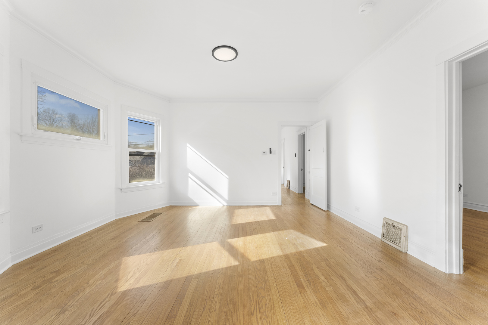 1035 South Ridgeland Avenue Oak Park, IL 60304 - Photo 6 of 33 a view of a livingroom with wooden floor and staircase