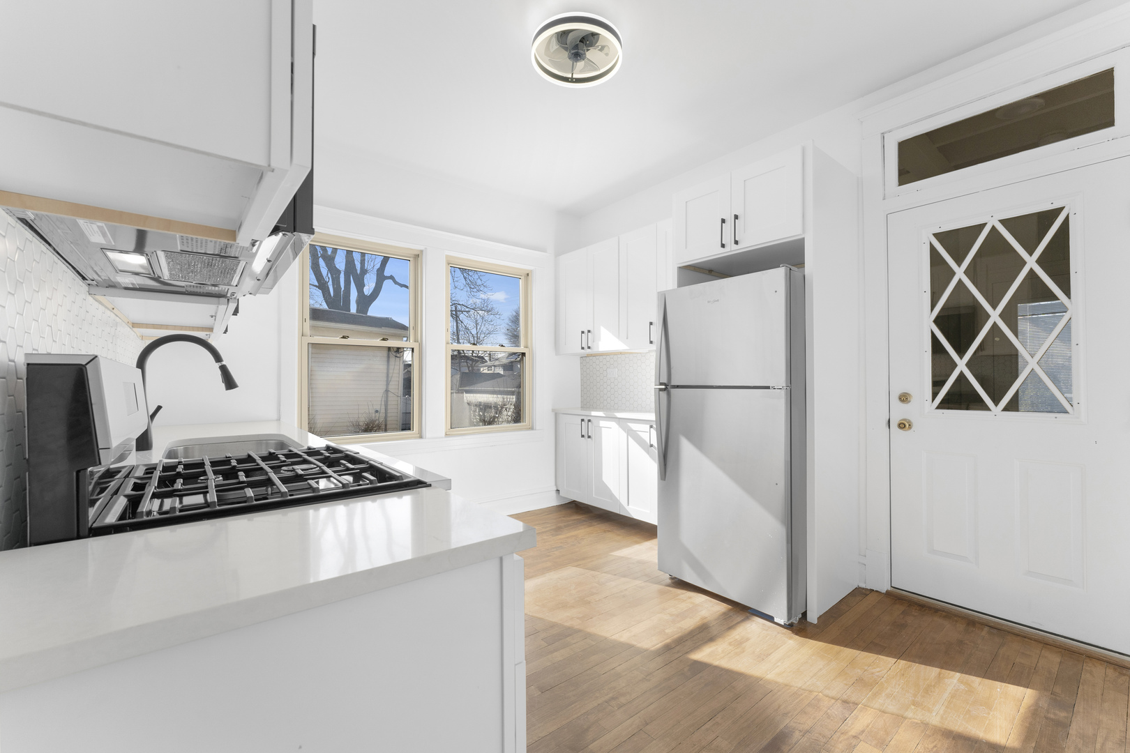 1035 South Ridgeland Avenue Oak Park, IL 60304 - Photo 8 of 33 a kitchen with cabinets and a window
