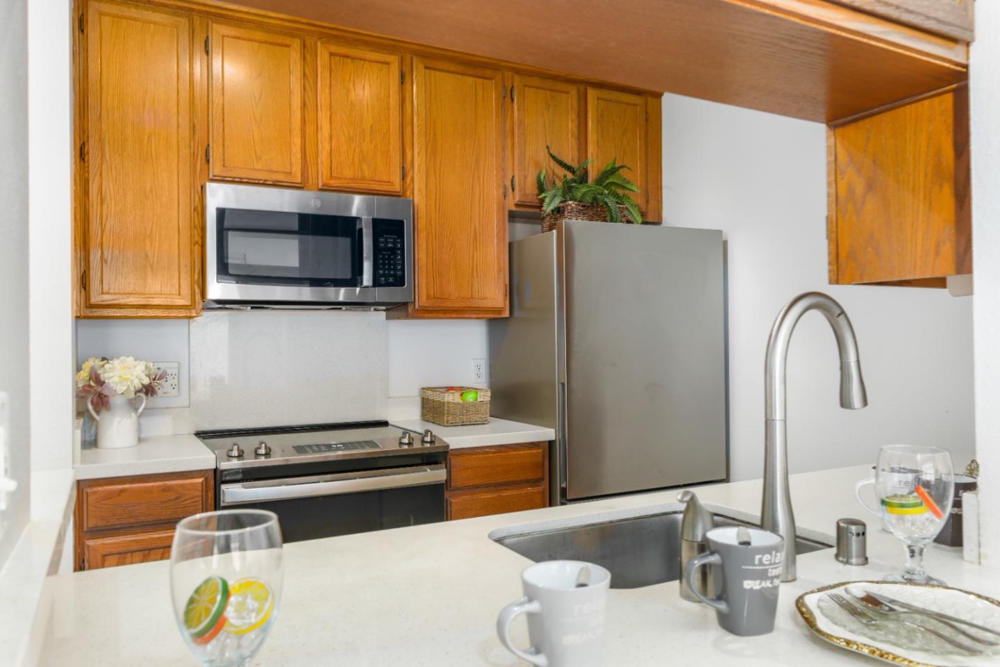 2029 Channing Way, Unit 3C Berkeley, CA 94704 - Photo 11 of 31 a kitchen with a sink appliances and cabinets