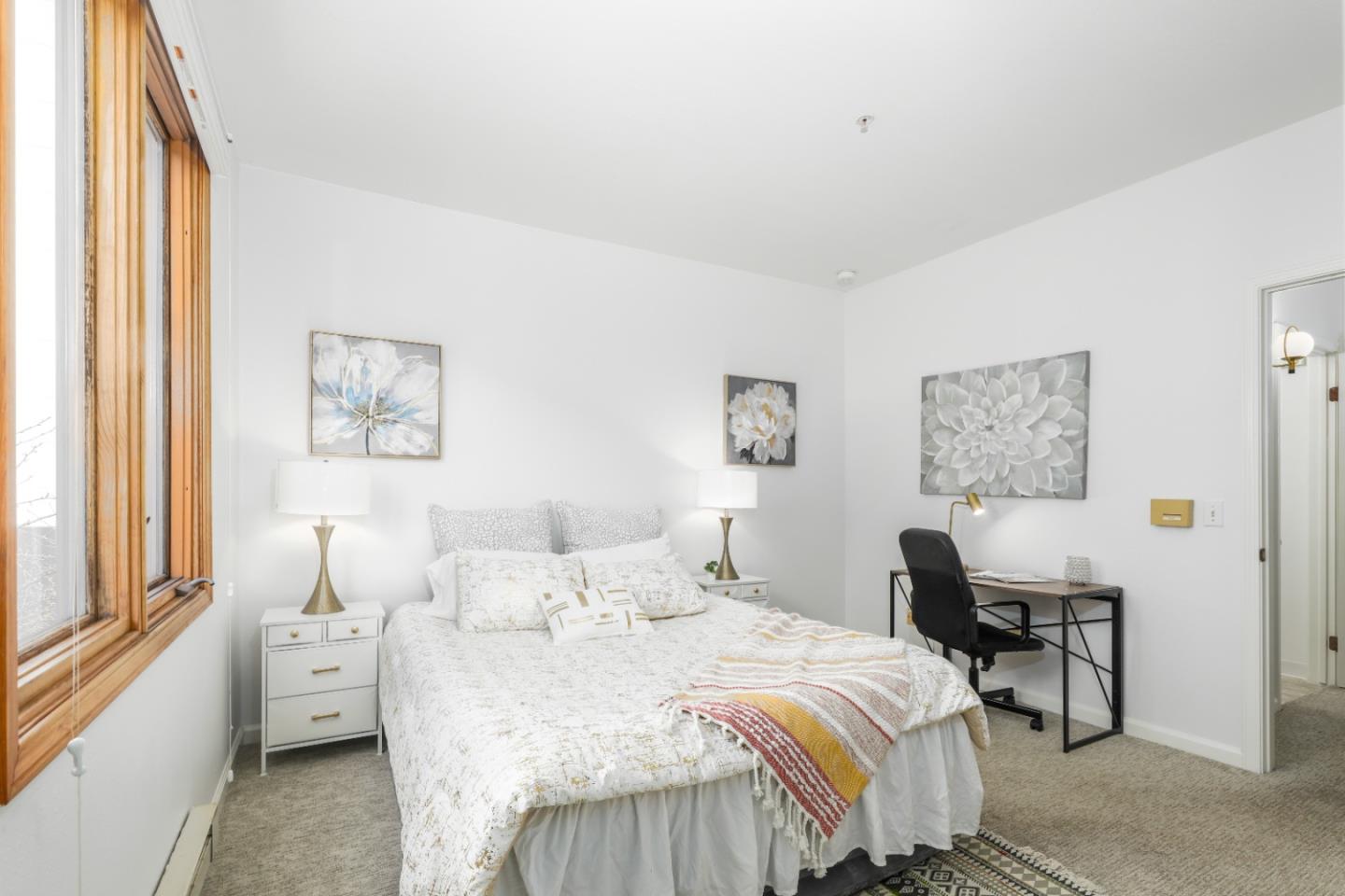 2029 Channing Way, Unit 3C Berkeley, CA 94704 - Photo 13 of 31 a bedroom with a bed and a large window