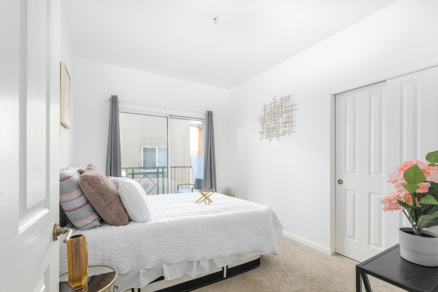 2029 Channing Way, Unit 3C Berkeley, CA 94704 - Photo 16 of 31 a bedroom with bed and a potted plant