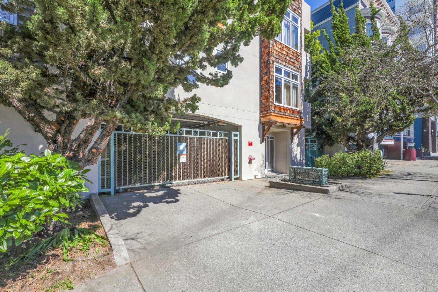 2029 Channing Way, Unit 3C Berkeley, CA 94704 - Photo 4 of 31 a view of a building with a tree