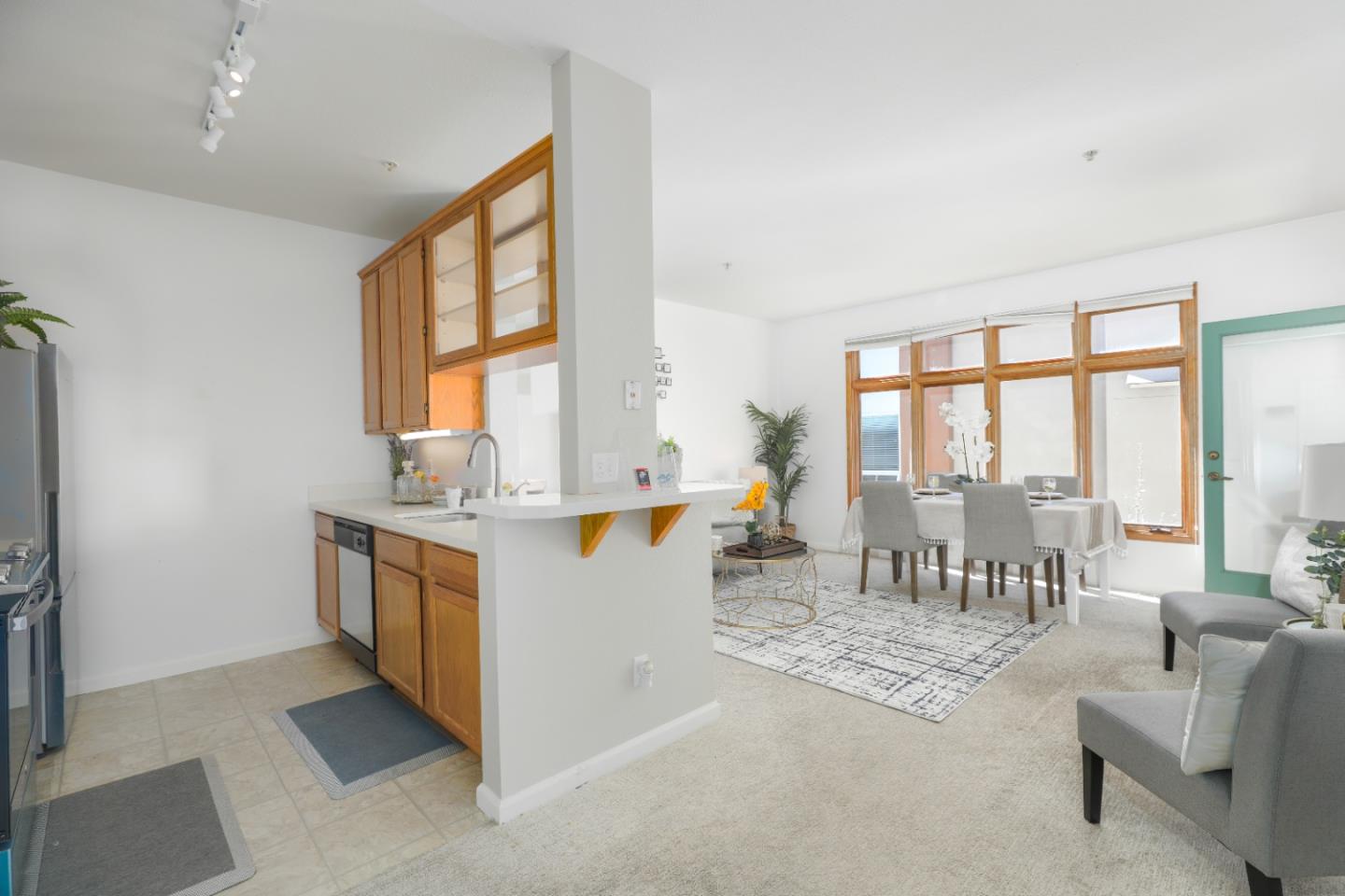 2029 Channing Way, Unit 3C Berkeley, CA 94704 - Photo 7 of 31 a living room with furniture a large window and dining table