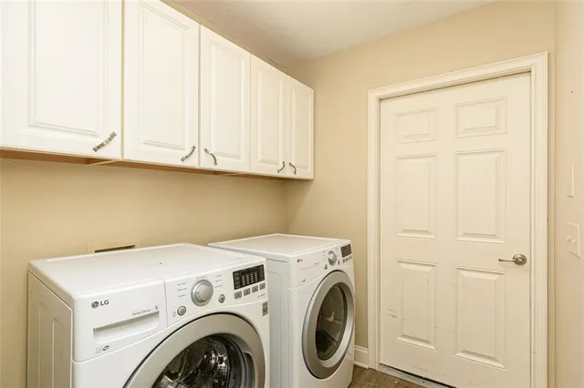 a utility room with dryer and washer