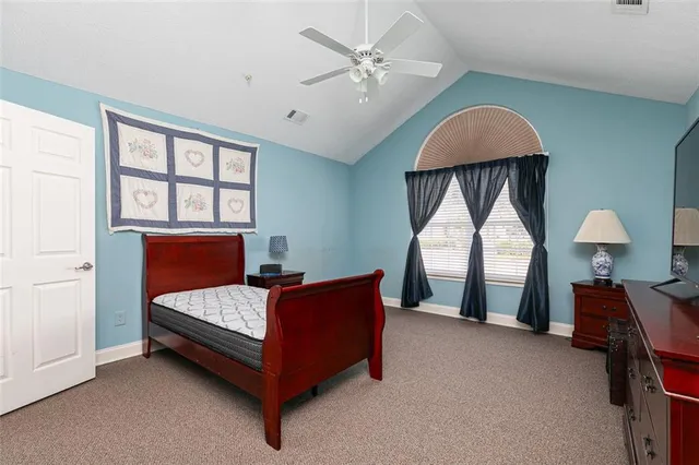 a bed room with a bed and a chandelier