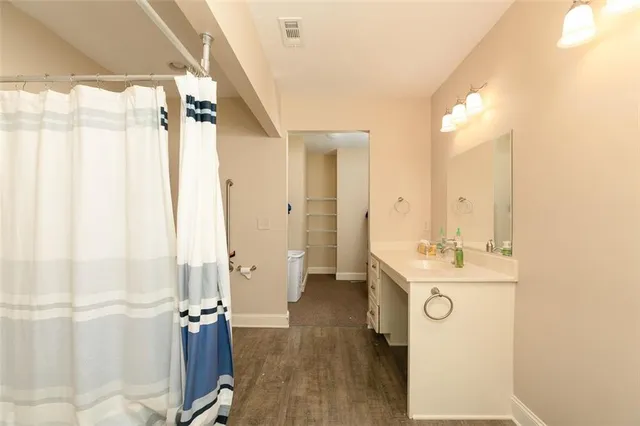 a view of a bathroom with a sink and mirror