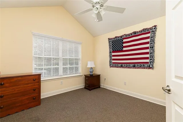 a room with a bed and a window