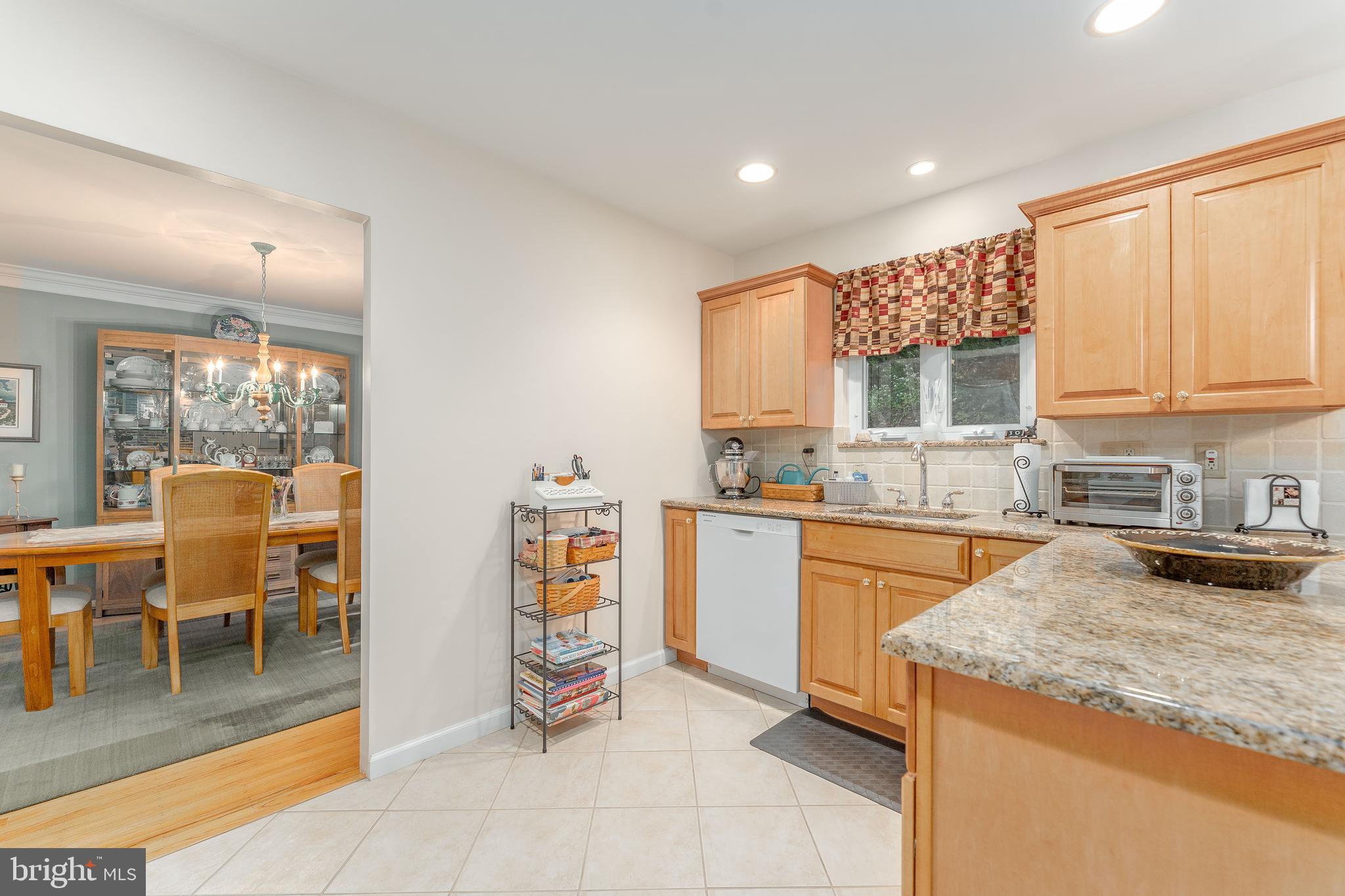 345 Ellis Road Havertown, PA 19083 - Photo 14 of 47 a kitchen with stainless steel appliances granite countertop sink stove top oven and cabinets