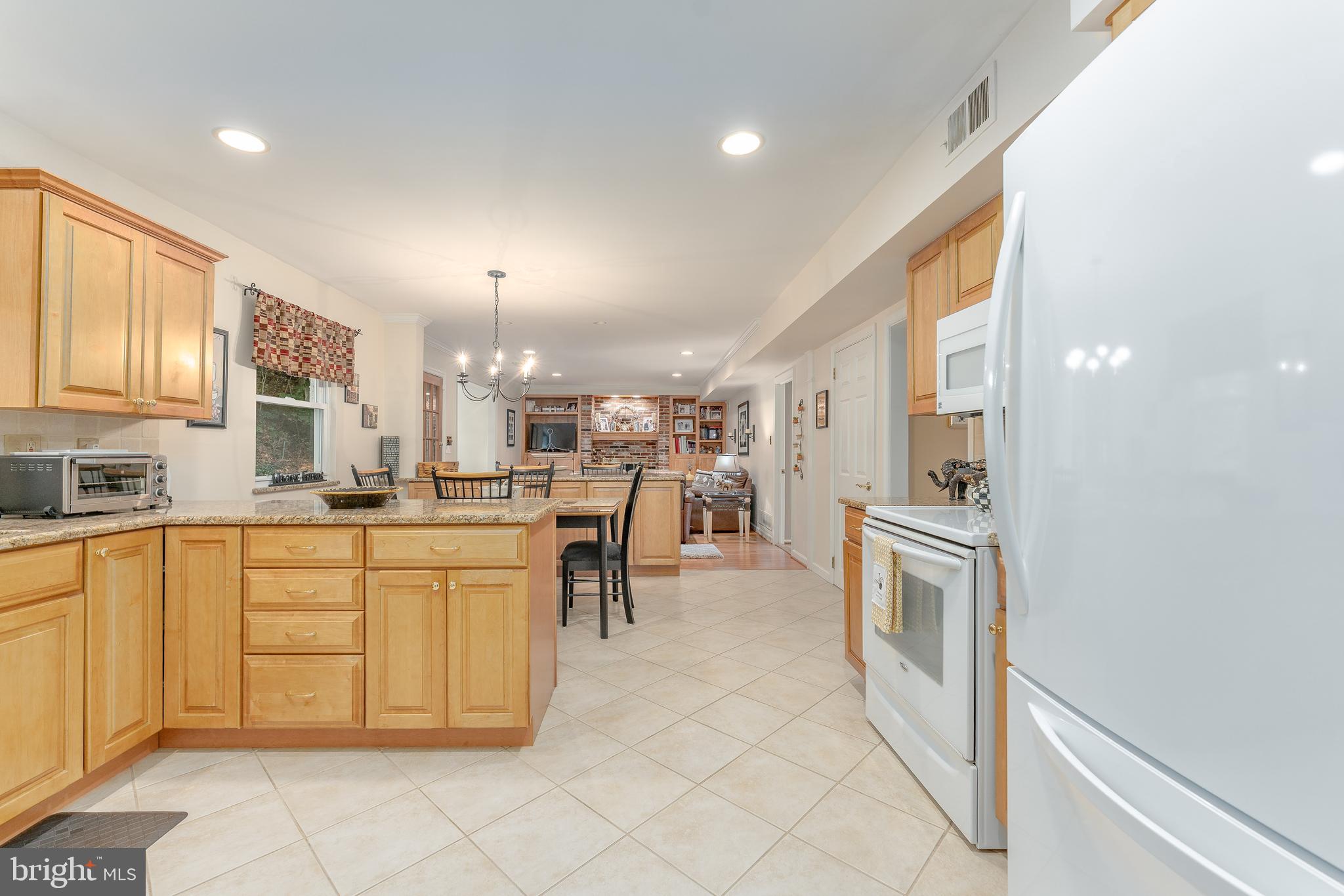 345 Ellis Road Havertown, PA 19083 - Photo 16 of 47 a kitchen with cabinets and chairs