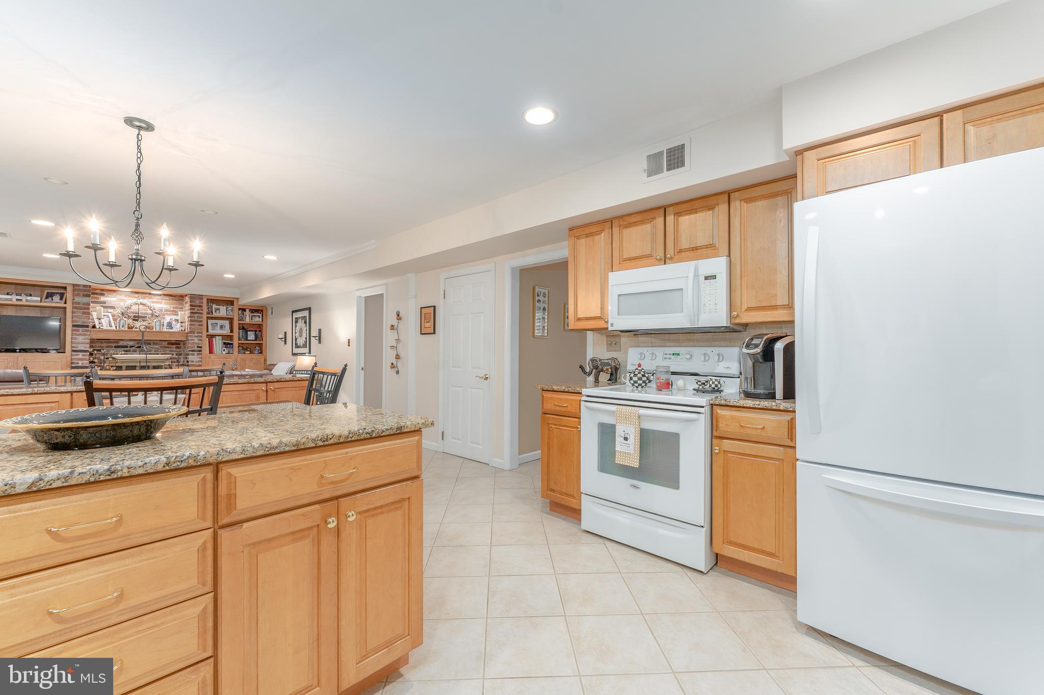 345 Ellis Road Havertown, PA 19083 - Photo 17 of 47 a kitchen with stainless steel appliances granite countertop a sink a stove and a refrigerator
