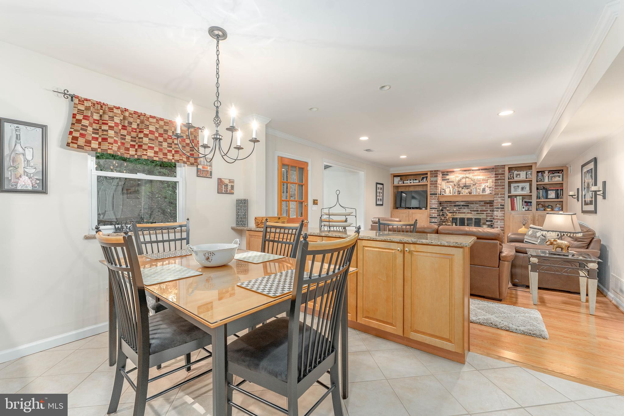 345 Ellis Road Havertown, PA 19083 - Photo 18 of 47 a dining room with a wooden table and chairs