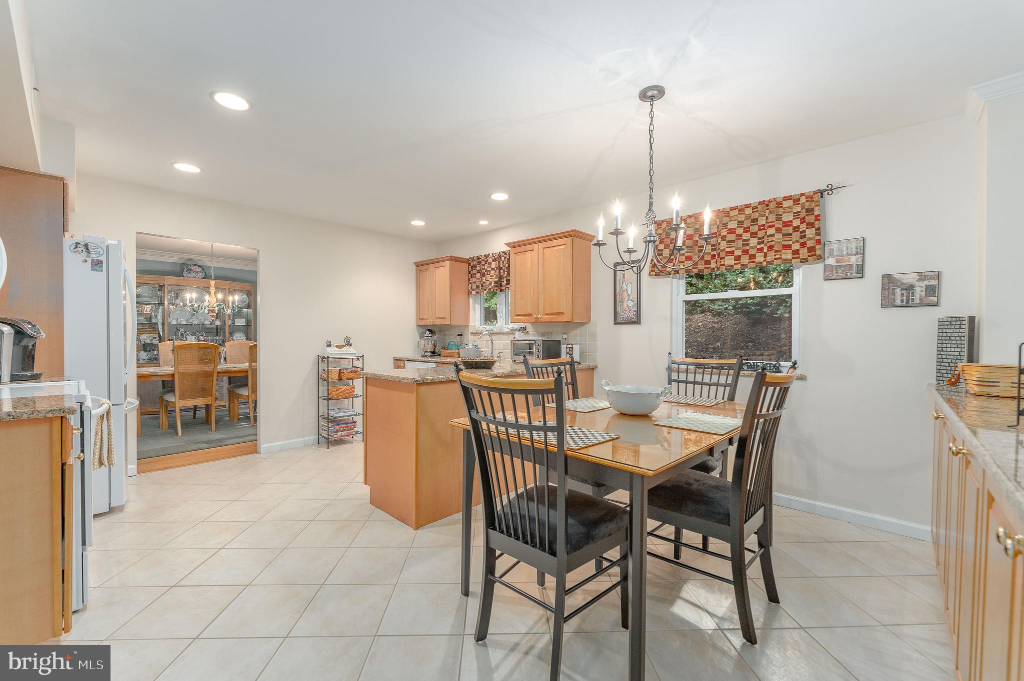 345 Ellis Road Havertown, PA 19083 - Photo 19 of 47 a dining room filled with furniture and a chandelier