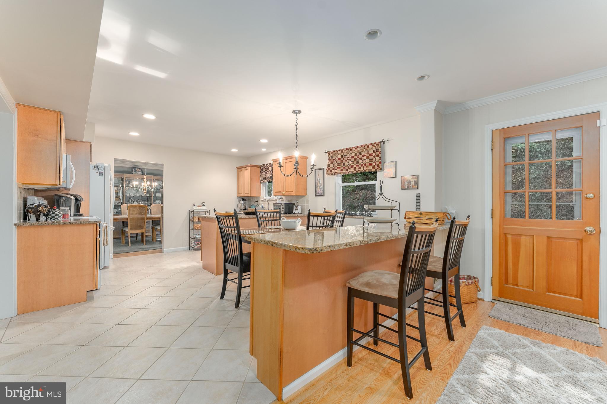 345 Ellis Road Havertown, PA 19083 - Photo 21 of 47 a dining area with furniture and a chandelier