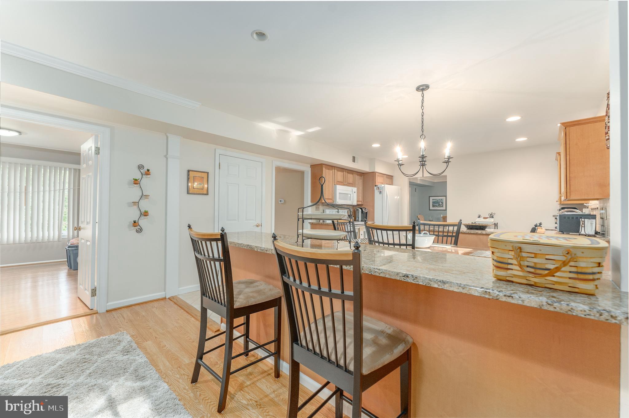 345 Ellis Road Havertown, PA 19083 - Photo 22 of 47 a view of a dining room with furniture and a chandelier