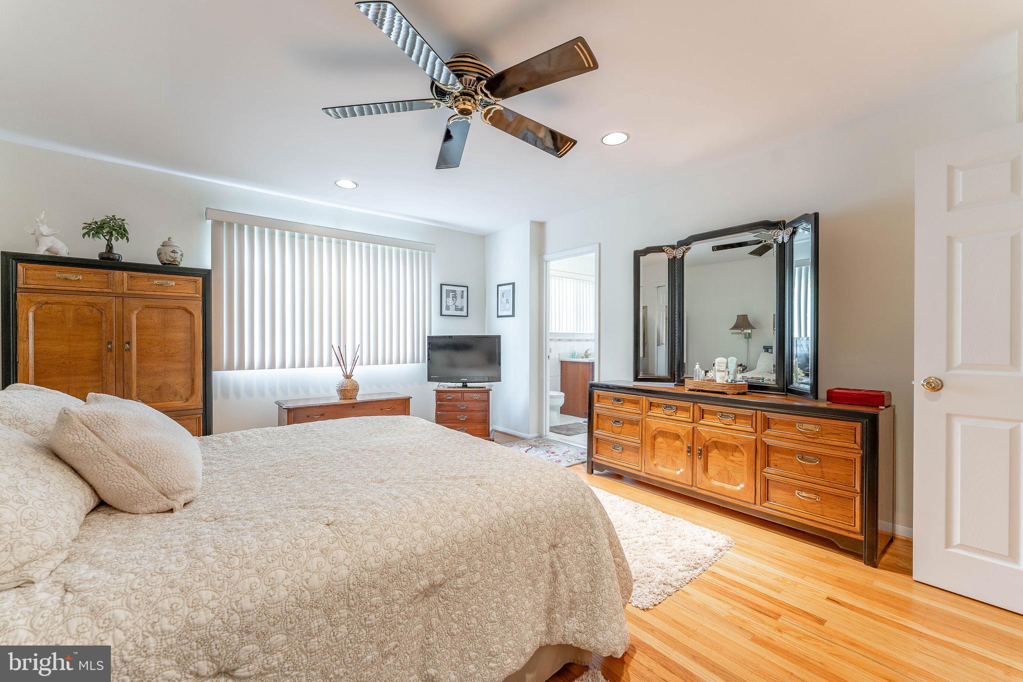 345 Ellis Road Havertown, PA 19083 - Photo 31 of 47 a large bedroom with a large bed a chandelier and dresser