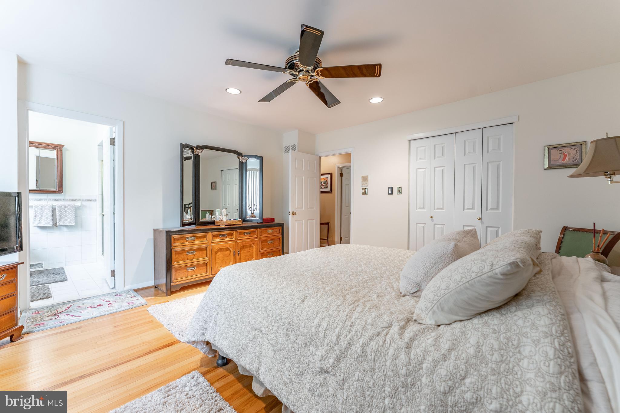 345 Ellis Road Havertown, PA 19083 - Photo 32 of 47 a bedroom with a bed and a chandelier