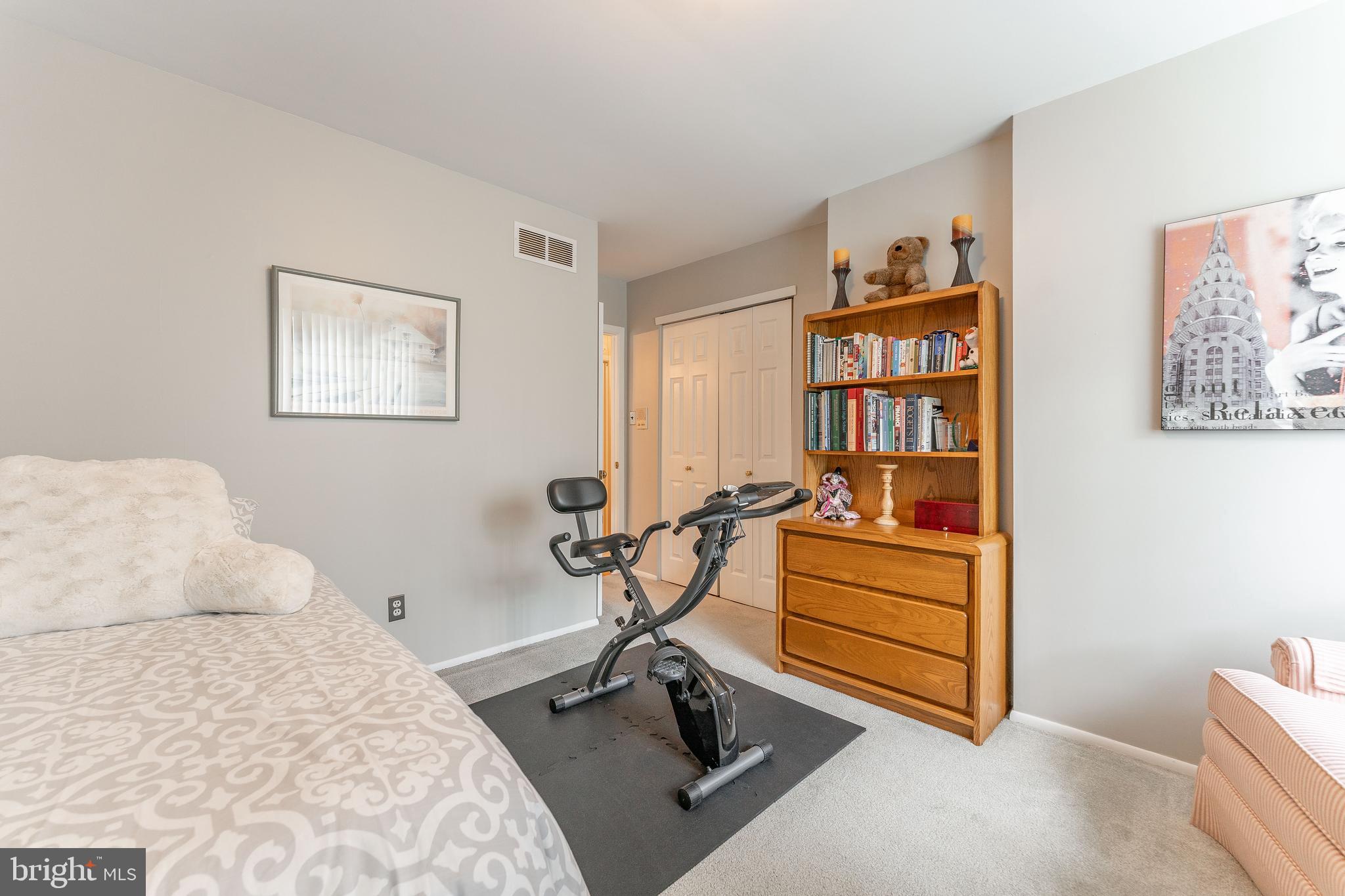345 Ellis Road Havertown, PA 19083 - Photo 36 of 47 a bedroom with furniture and a book shelf