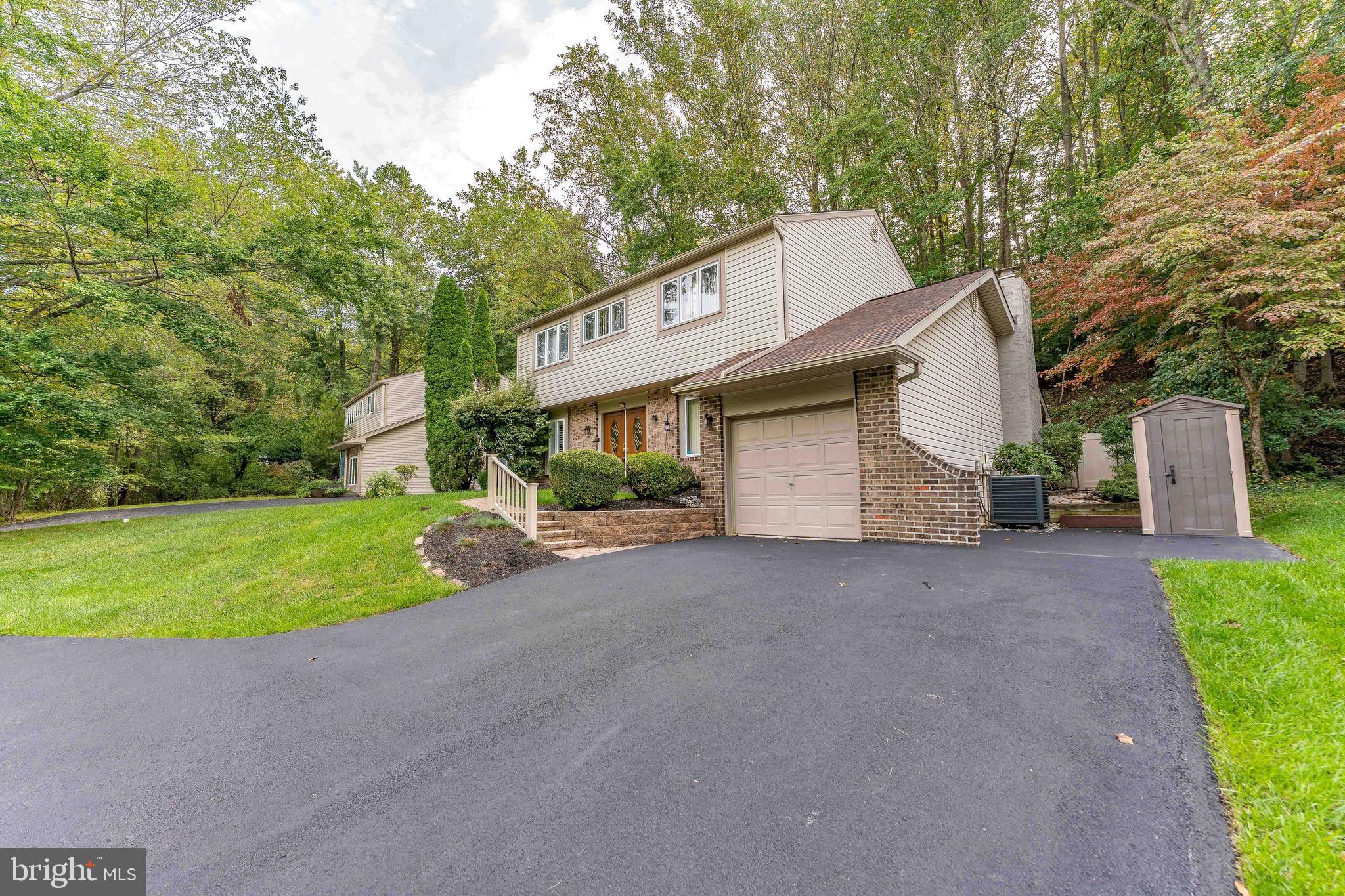 345 Ellis Road Havertown, PA 19083 - Photo 4 of 47 a view of a house with a yard and garage