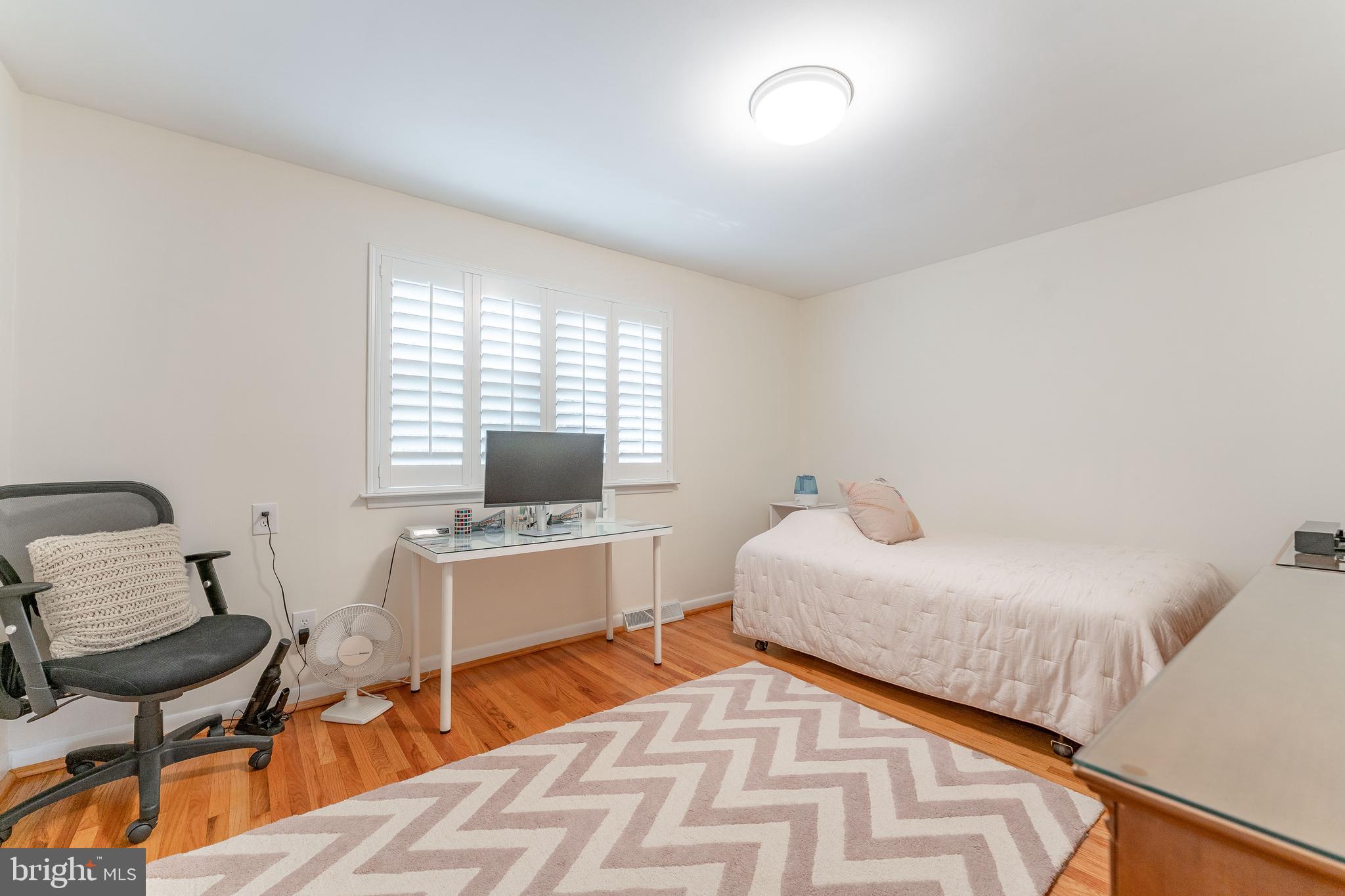 345 Ellis Road Havertown, PA 19083 - Photo 41 of 47 a bedroom with a bed and a chair