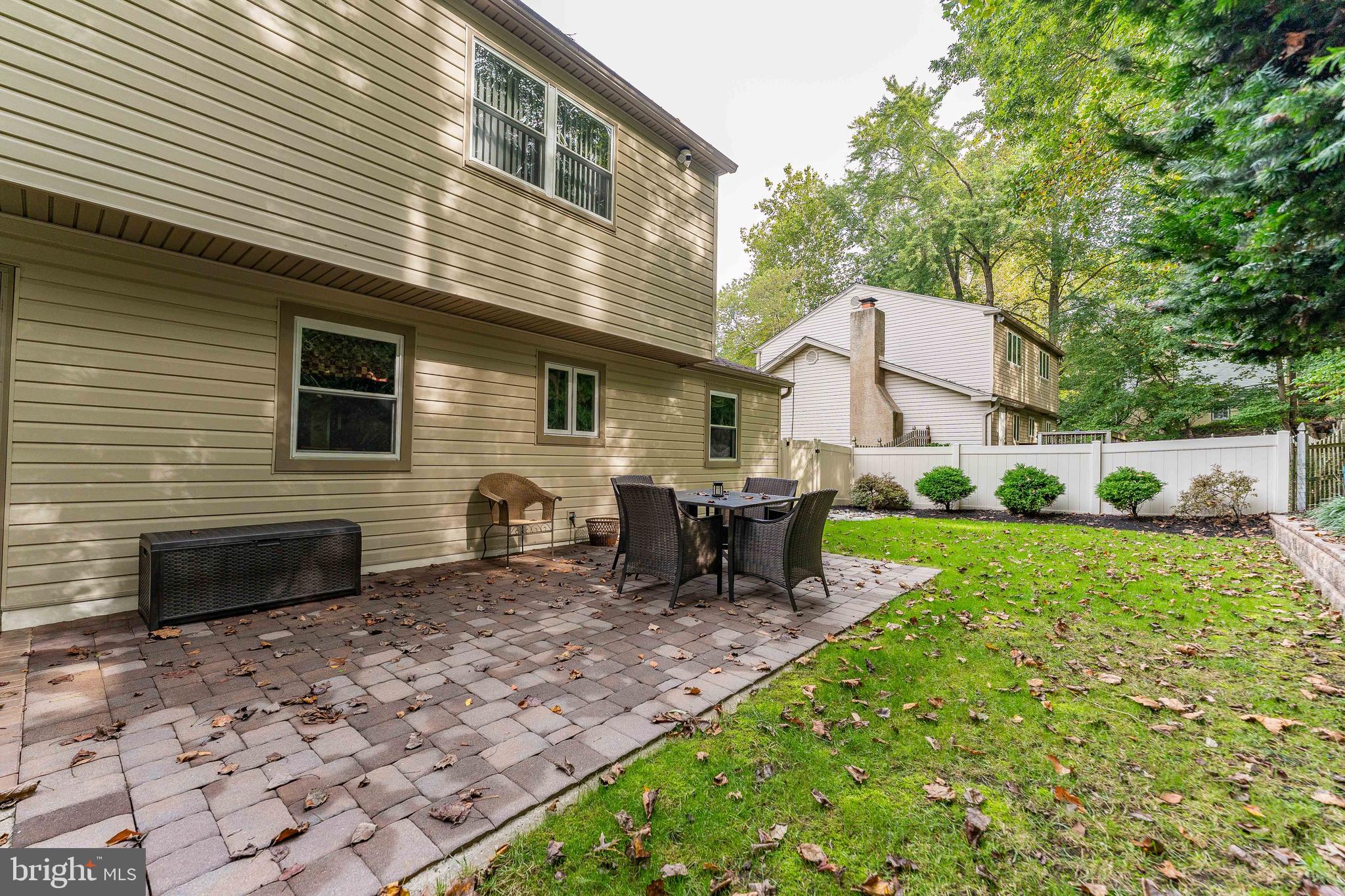 345 Ellis Road Havertown, PA 19083 - Photo 45 of 47 a backyard of a house with table and chairs