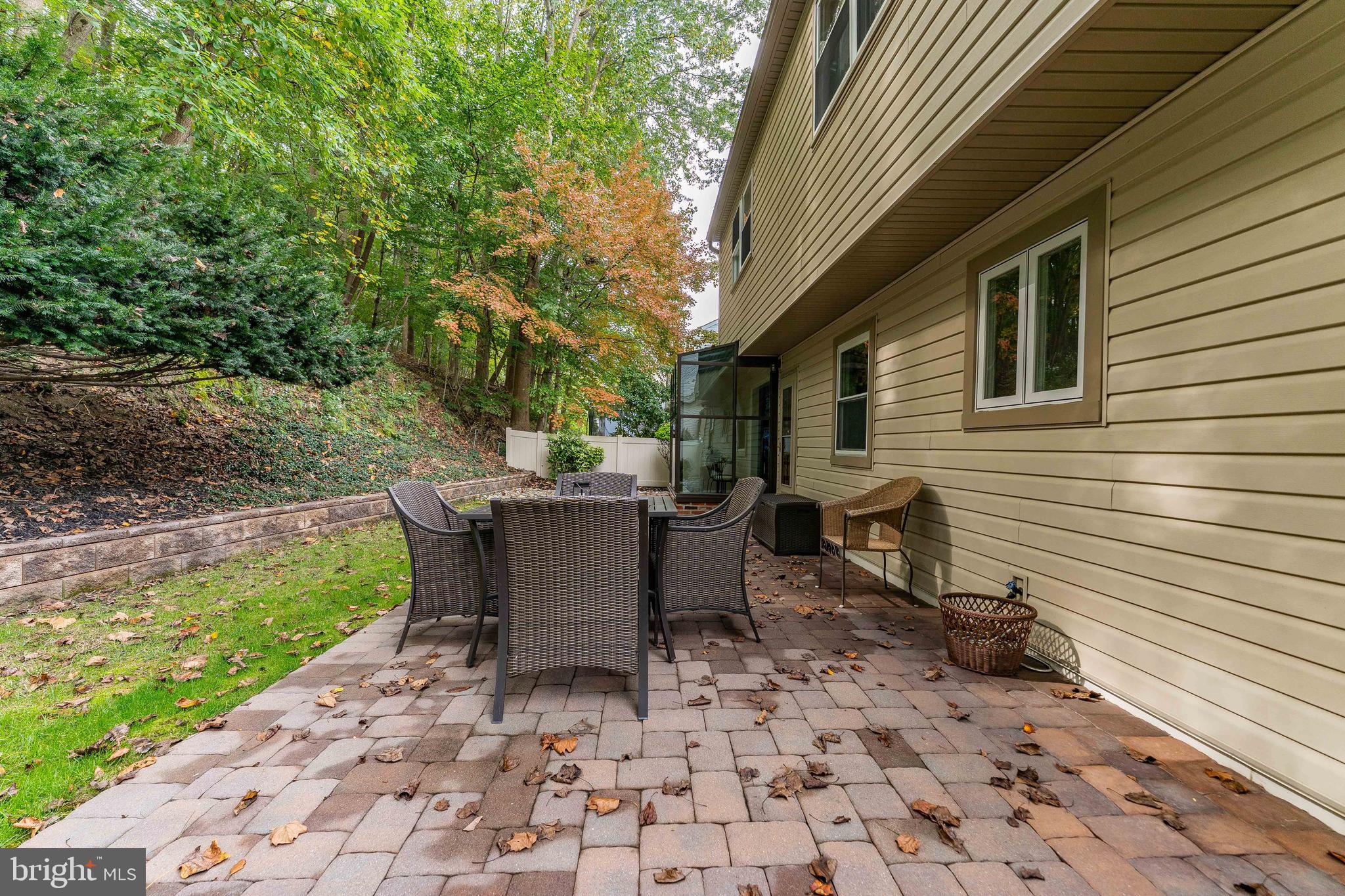 345 Ellis Road Havertown, PA 19083 - Photo 46 of 47 a view of a patio with a table and chairs next to a yard