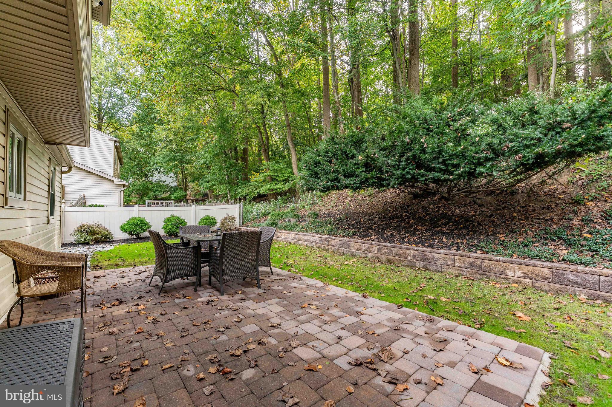 345 Ellis Road Havertown, PA 19083 - Photo 47 of 47 a view of a patio with table and chairs and potted plants