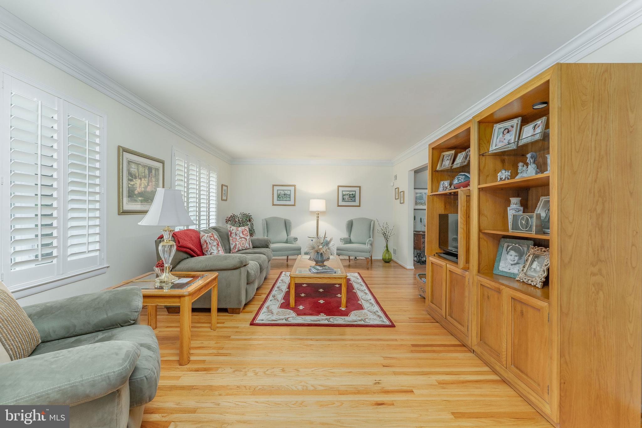 345 Ellis Road Havertown, PA 19083 - Photo 8 of 47 a living room with furniture and a book shelf