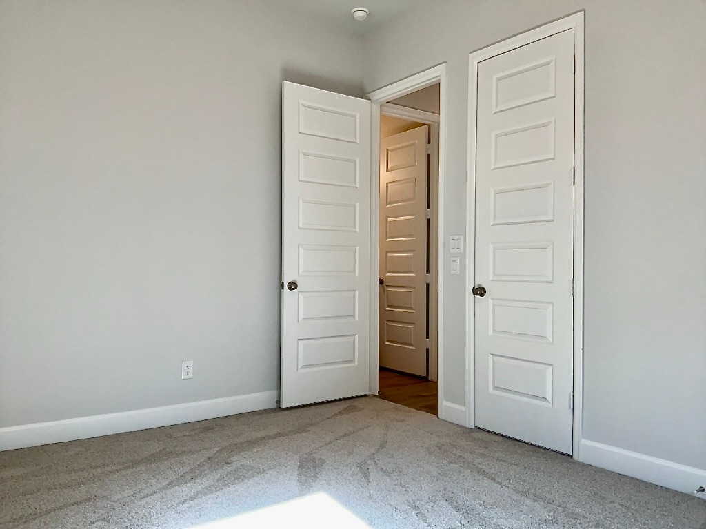 1636 Laverne Mitchell Street Leander, TX 78641 - Photo 14 of 20 Bedroom 3 featuring carpet flooring and baseboards