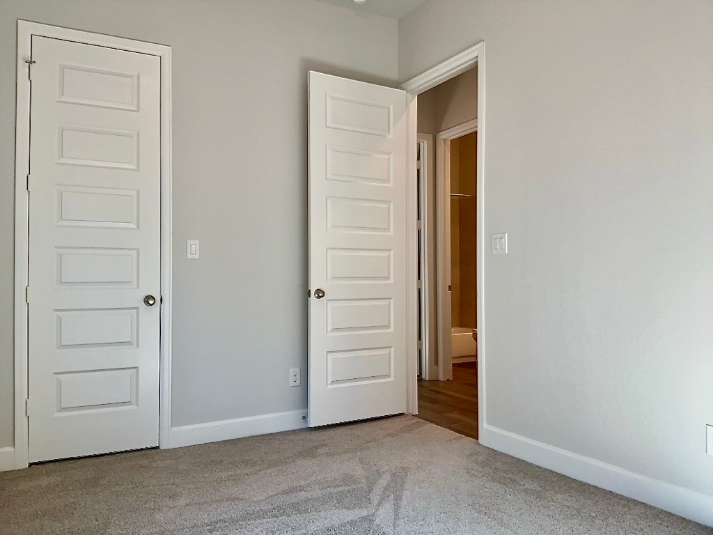 1636 Laverne Mitchell Street Leander, TX 78641 - Photo 16 of 20 Bedroom 4 with carpet flooring and baseboards