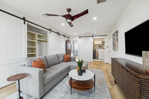 a bathroom with a sink a toilet and a shower curtain