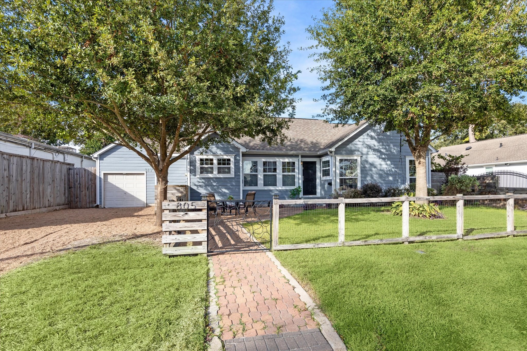 805 Sue Street Houston, TX 77009 - Photo 24 of 25 a front view of a house with a yard table and chairs