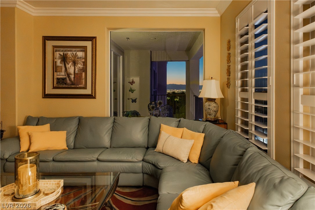 2555 Hampton Road, Unit 3308 Henderson, NV 89052 - Photo 43 of 65 City lights twinkle beyond a private balcony, offering serene evening views from this cozy living space.