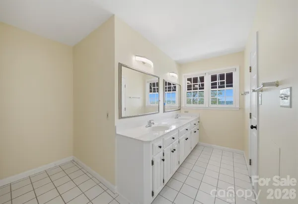 a bathroom with granite countertop a sink and a mirror