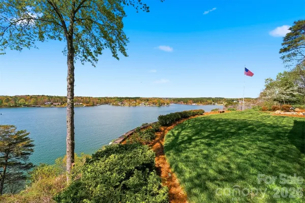 a view of a lake with a big yard