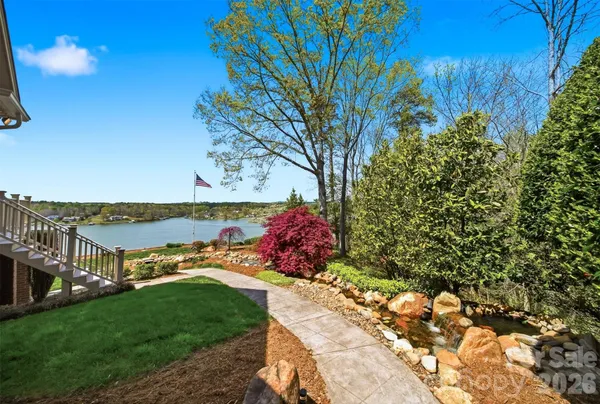 a view of a lake with furniture